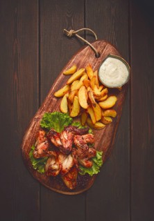 Fried chicken wings, with potatoes, and spices, homemade, fast food, no people