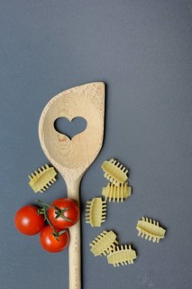 Cooking spoon with heart and Italian pasta, Radiatori variety