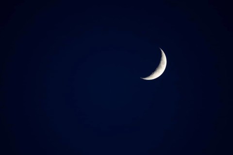 Evening sky with crescent moon, Germany