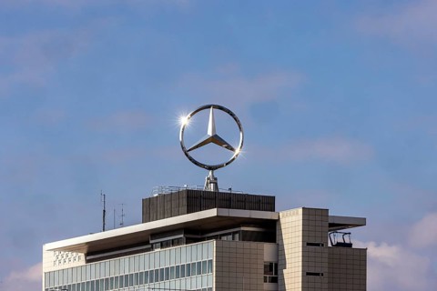 Mercedes star with sun star. Building at the headquarters of Mercedes-Benz Group AG in