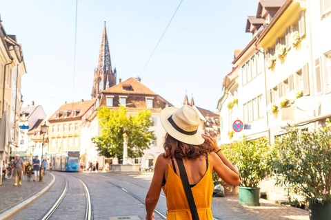 Walking past the Freiburg Minster in the city of Freiburg im Breisgau, Germany