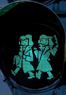 Pedestrian traffic light with green Brothers Grimm Ampelmännchen, Hanau, birthplace of the