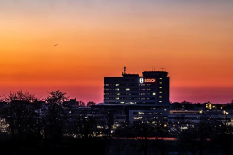 Bosch factory at sunset. Illuminated logo of the company. Schwieberdingen, Baden-Württemberg,