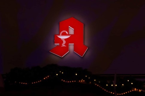 Night shot, logo, red neon sign, pharmacy sign with Aesculapian staff, Aesculapian staff, Christmas