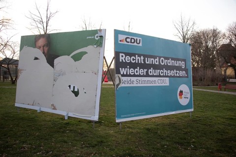 Two election posters of the CDU and the Greens on a lawn with bare trees, Biederitz, Saxony-Anhalt,