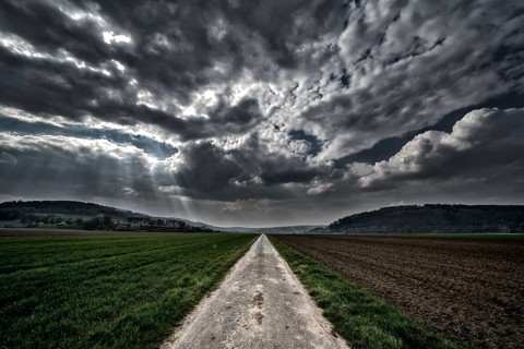 Bike path R1 with a dramatic cloudy sky, near Wesertal, Weser Uplands, Weserbergland, Hesse,