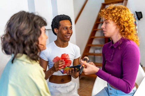 Lgtb multi-ethnic group of friends making up and talking together at home before party