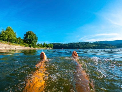Feet of a man bathing in Lake Schluch in the Black Forest in Germany