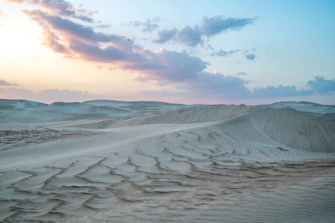 Sunset, white sand dunes in the Khaluf desert, Oman