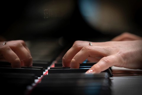 Hand of a young pianist playing on the keyboard of a Steinway & Sons grand piano, Stuttgart,