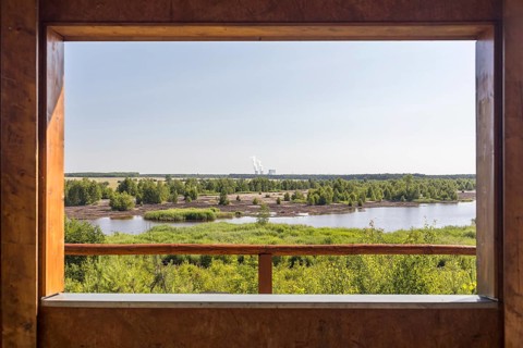 Viewpoint at Lake Bergen, which is still being flooded, with the towers of the Schwarze Pumpe power