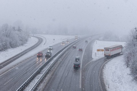 Motorway in driving snow with vehicles and foggy visibility, Winnenden, Baden-Württemberg, Germany