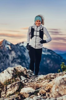 Trail running in autumn on the Jochberg on Lake Walchensee against the wonderful backdrop of the