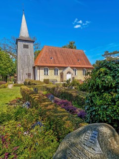 Arnis skipper's church with cemetery, brick church with wooden tower, sailor's gravestone with