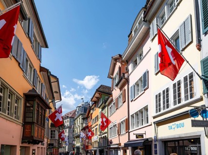 Augustinergasse with Swiss flags, Old Town, Zurich, Switzerland