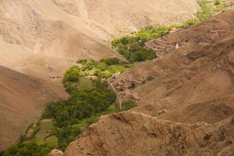 River valley with small fields and village with Berber mud houses, Ait Bouguemez Valley, High
