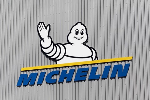 Michelin, company logo with Michelin man, Bibendum, on a warehouse, Logoport, Duisburg, North