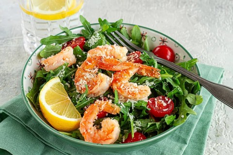 Shrimp salad with arugula and cherry tomatoes, with parmesan cheese, healthy food