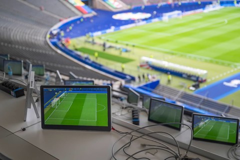 Commentary stations with monitors in the football stadium