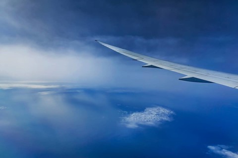 Blue sky, cloud structures over the Arabian Sea. View from the aircraft window during a flight from