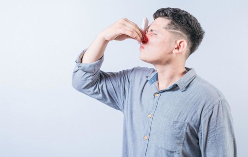 Portrait of person with nasal congestion isolated. People suffering with irritated nose isolated