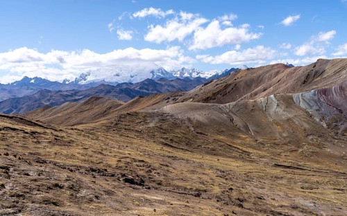 View from Palccoyo to cloudy snow-capped mountains, barren landscape, Peruvian Andes, Checacupe