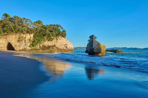 Calm beach with gentle waves and rocks, Cathedral Cove, Coromandel, Canterbury, North Island, New