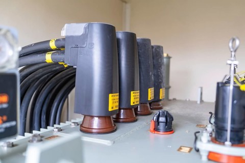 Detailed view of cable connections and a transformer in industry, switch cabinet construction, PV