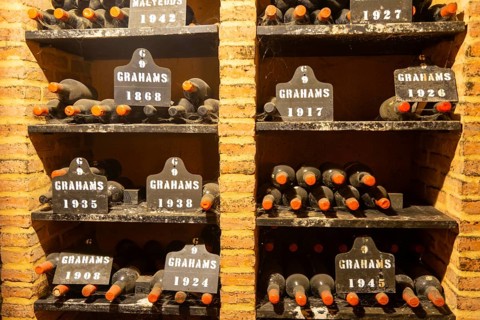 Vintage port wine bottles in cellar of Graham's port wine lodge, Vila Nova de Gaia, Porto, Portugal
