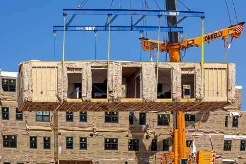 Detroit, Michigan - Workers use modular construction methods to build apartments for low to