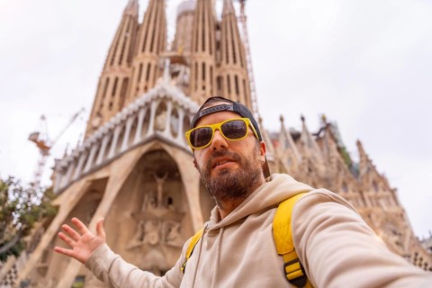 Selfie of a tourist on vacation at the Sagrada Familia Basilica in Barcelona, Spain