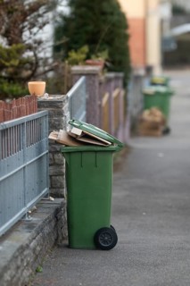 Paper waste bin for emptying on pavement, Stuttgart, Baden-Württemberg