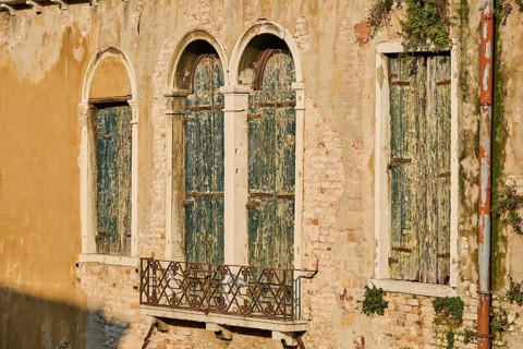 Windows of an old house in Venice on a sunny day in winter, Italy