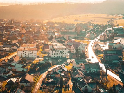 Bird's eye view of a village landscape in warm autumnal light, Neubulach, Black Forest, Germany