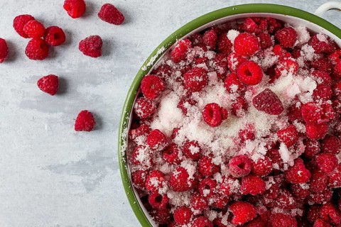 Fresh raspberry berry, covered with granulated sugar, jam preparation, top view, no people