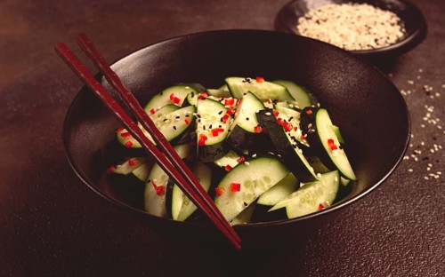 Chinese salad, cucumbers with chili pepper and sesame seeds, homemade, no people