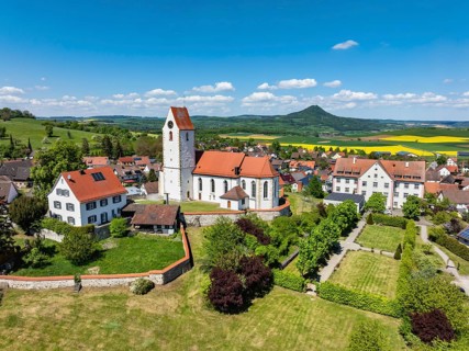 Aerial view of the municipality of Weiterdingen in Hegau with the church of St Mauritius, on the