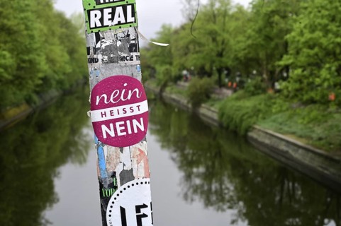 No means No is written on a metal post on the Thielen Bridge over the Landwehr Canal on the border