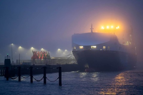 Thick fog in winter, hanging over the mouth of the Elbe into the North Sea, DFDS ferry Britannia