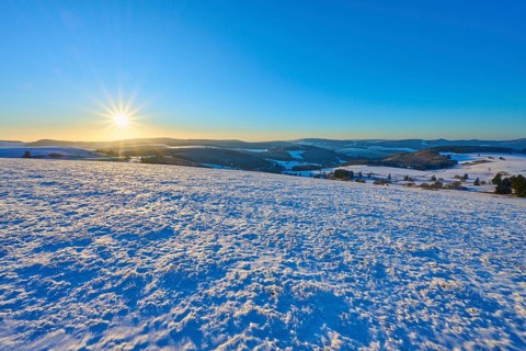 Clear sunrise over snow-covered hills, winter, Wasserkuppe, Gersfeld, Rhön, Hesse, Germany