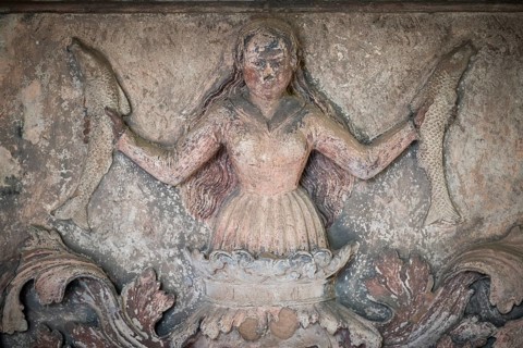 Woman holding fish in her hands, frieze, Städtisches Lapidarium, City of Stuttgart,