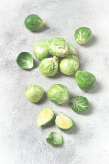 Fresh Brussels sprouts, raw, top view, on a gray table, no people