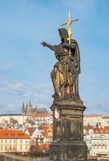 Statue of John the Baptist with the Prague Castle, Charles Bridge, Praha, Czech Republic
