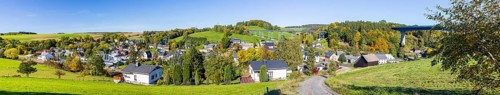 Panoramic view of the town with Markersbach viaduct, historic metal railway bridge in