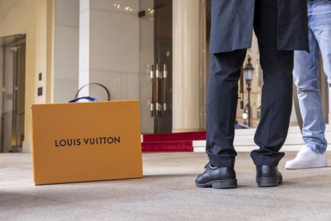 Shopping bag of the luxury brand Louis Vuitton, Hotel Vier Jahreszeiten Kempinski Munich with red