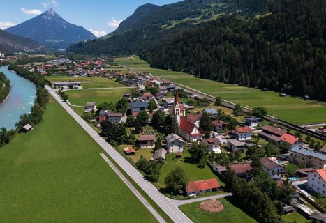 Drone shot, view of village with parish church, Schönwies, Inn, Oberinntal, Tyrol, Austria