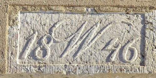 Year 1846 and W in sandstone above a door visible from a residential building, Elbersdorf,