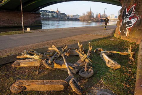 Several electric scooters that were pulled out of the Main in Frankfurt lie as scrap metal on the