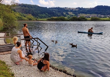 People at the bathing place of the Meerfelder Maar, Maarsee, Meerfeld, district