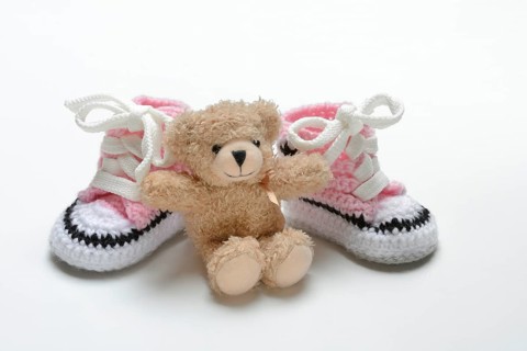 Pink baby shoes with teddy bear